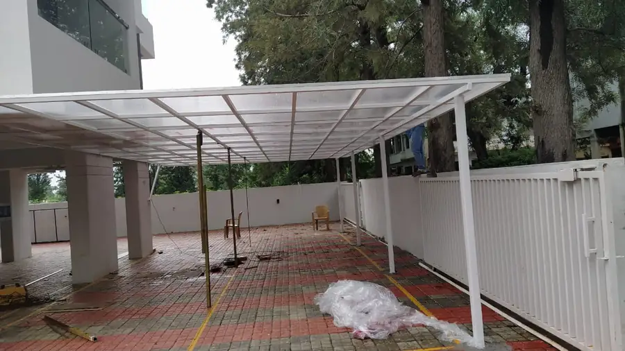 White-finished pergola structure over a terrace