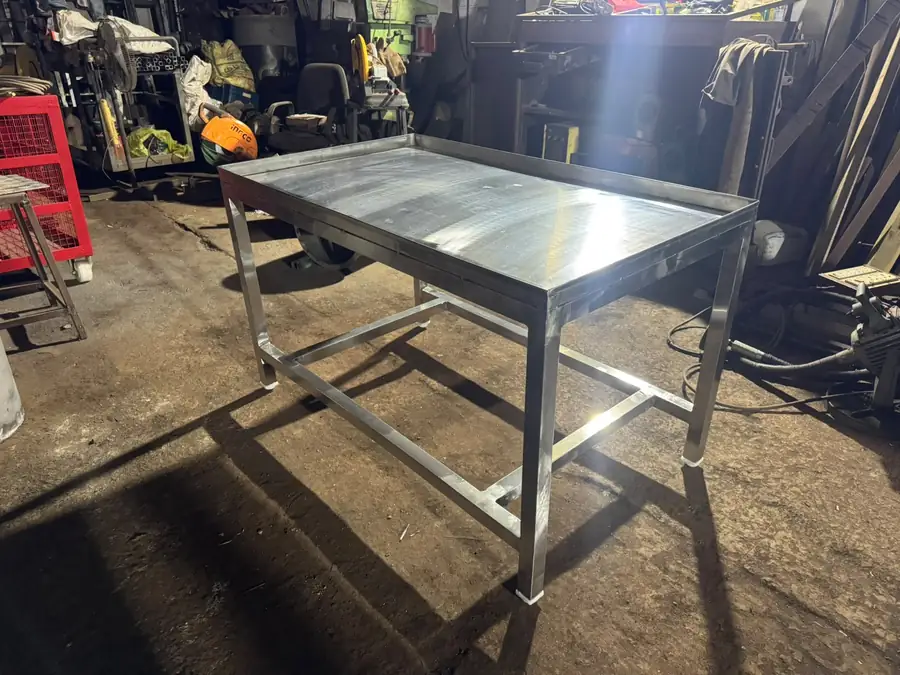 Stainless steel work table with flat hygienic top