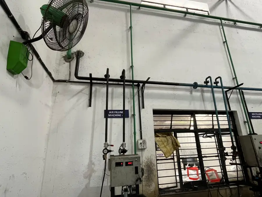 Shop floor with services, fans and finished racks awaiting dispatch