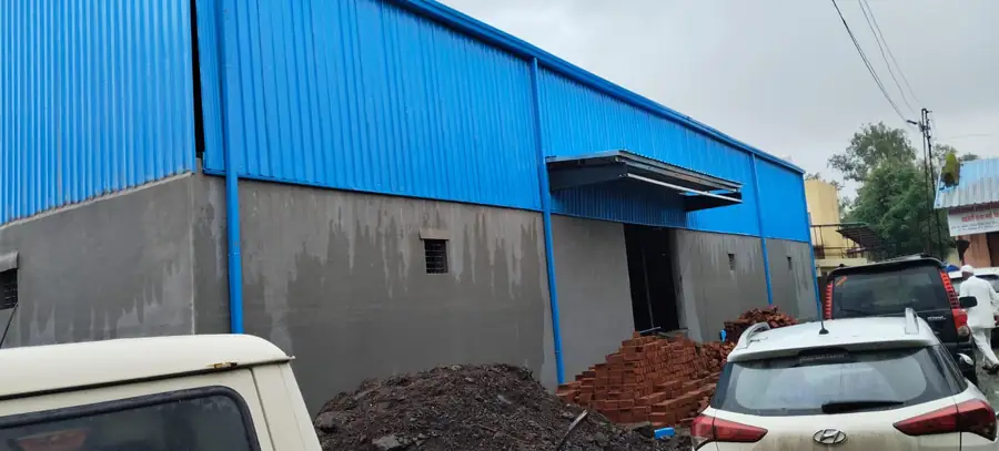 Industrial shed interior with blue profile sheet cladding