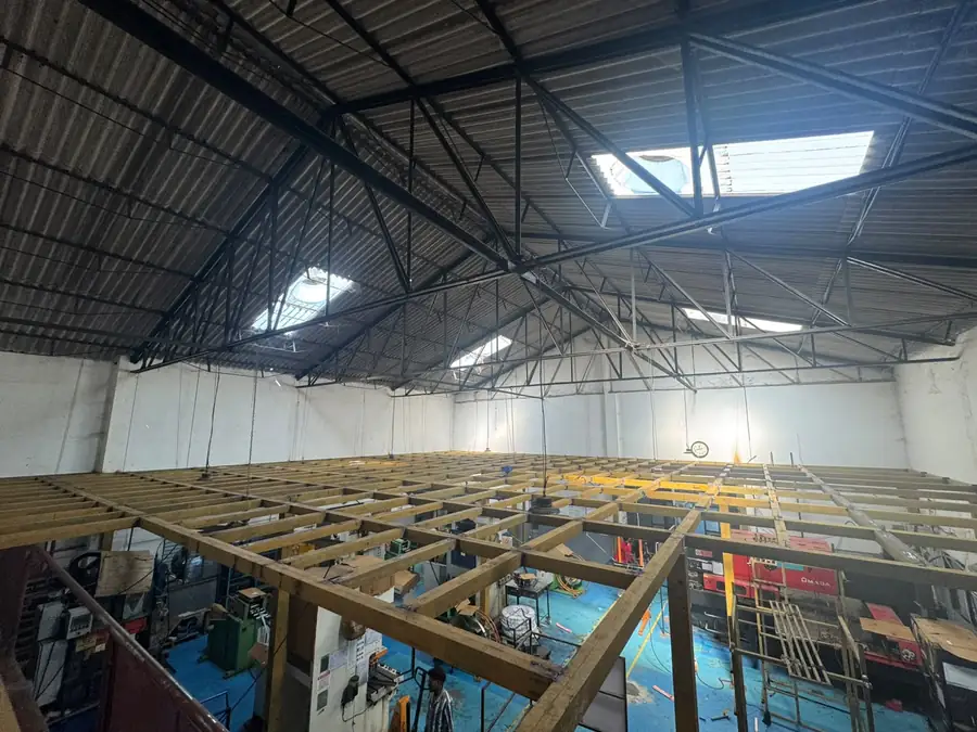 Steel mezzanine deck spanning a factory bay
