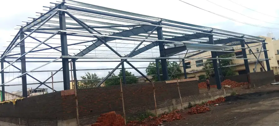 MS shed truss frame erected, viewed against open sky