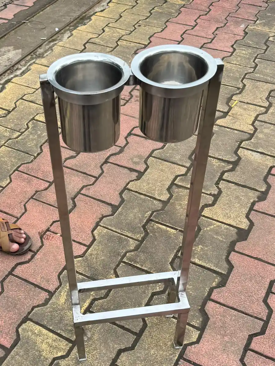 Pair of stainless steel jacketed vessels on fabricated stands