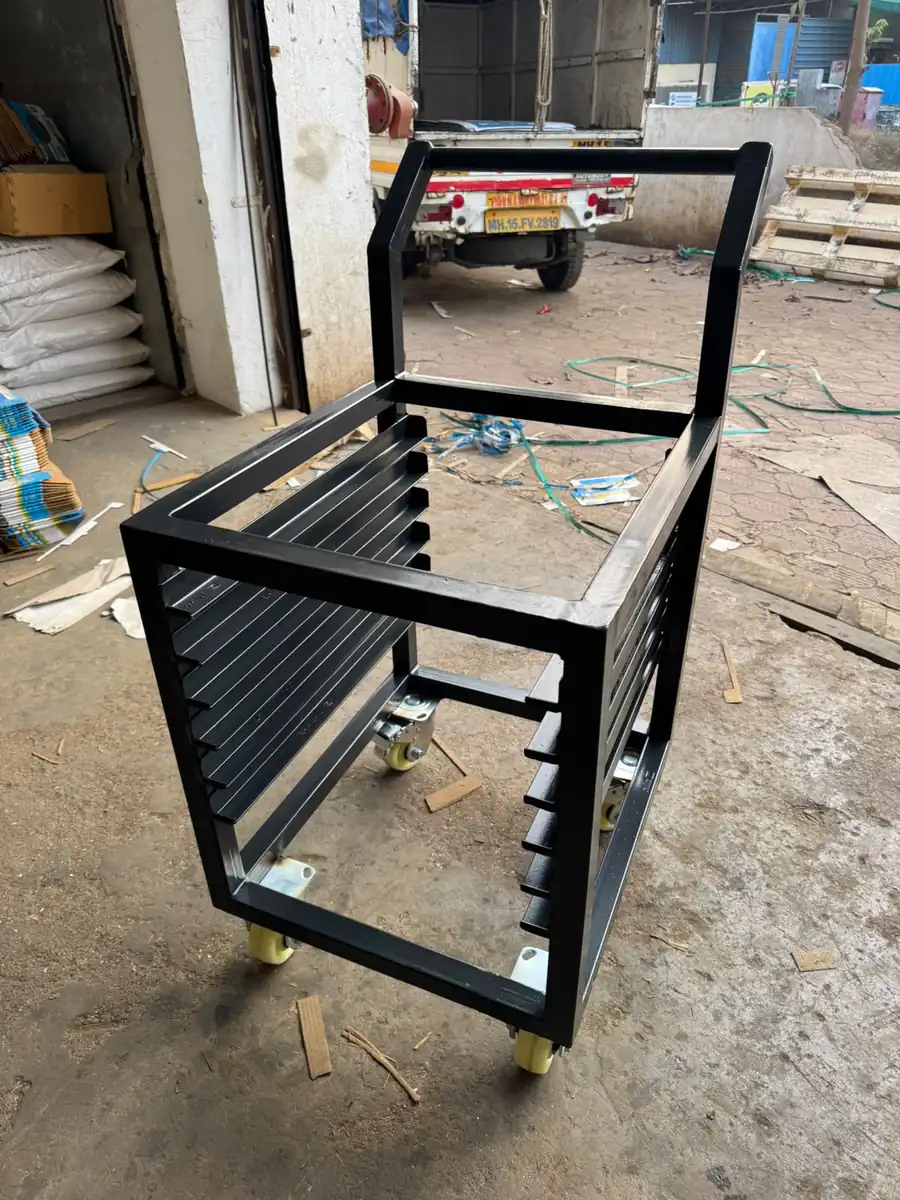 Slotted panel trolley frame fabricated in MS